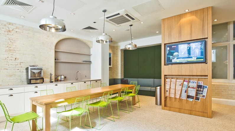 Green Park House's vibrant kitchen with bright green chairs