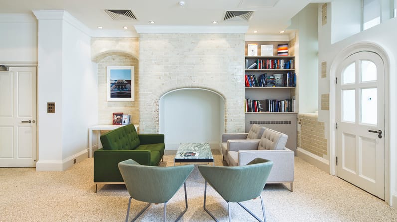 Green Park House's vibrant kitchen with bright green chairs
