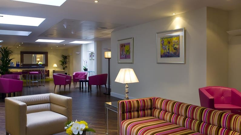 78 Pall Mall's lounge breakout space with colourful striped sofas