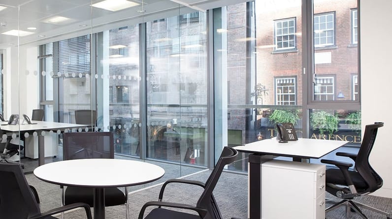 48 Dover Street's light-flooded open plan offices with floor to ceiling windows 