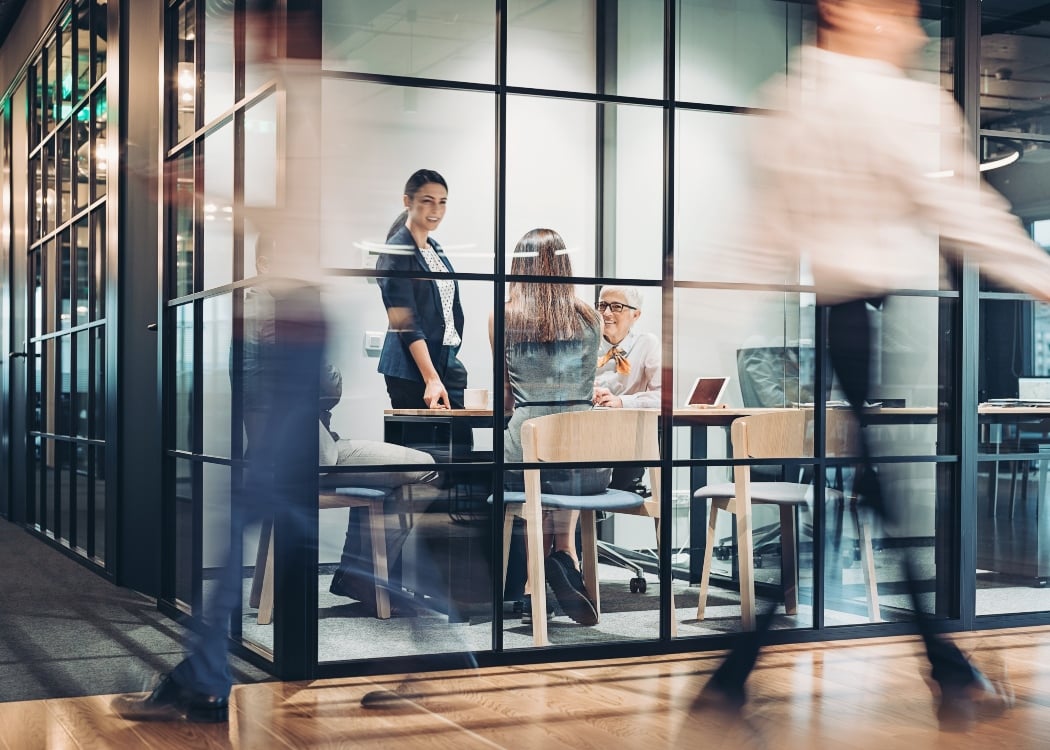 A busy office and a meeting room
