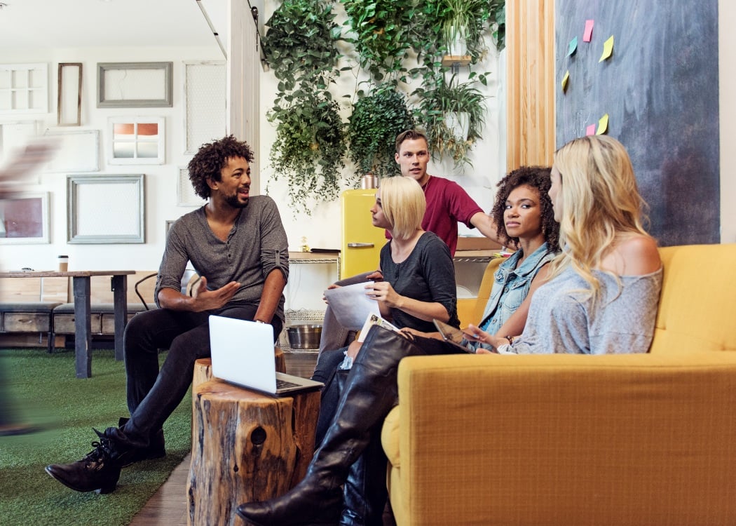 A group of team members meeting in office space